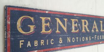 A customized General Store sign with Fabric and Notions lettering
