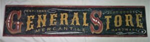 General Store 1885 Sign example with a rustic black background and gold lettering