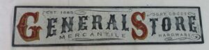 General Store 1885 Sign with gold and red lettering