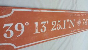 Example of a personalized coordinates sign, Ocean City in rustic orange