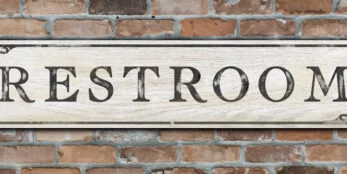 A vintage inspired Restroom wood sign