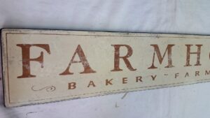 The Farmhouse bakery, farm fresh sign in antique white with nutmeg letters