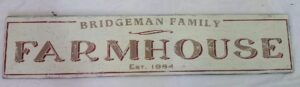 The Bridgeman family farmhouse sign in antique white and distressed