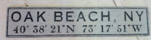 Oak Beach Coordinate sign example in light gray with black lettering