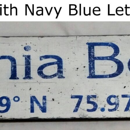 white coordinate city and state wood sign