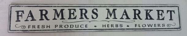 The original Farmers Market sign, with Fresh Produce Herbs Flowers lettering underneath.