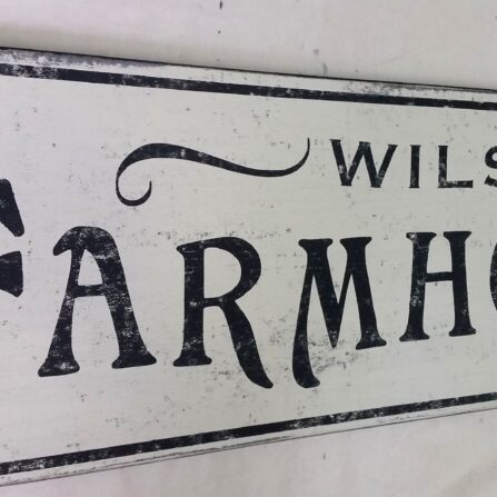 Closeup of the Farmhouse Bakery Sign with custom name