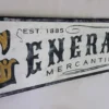 Detailed view of rustic General Store sign showcasing distressed lettering and wood texture