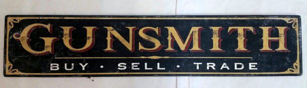 Gunsmith sign in black and gold