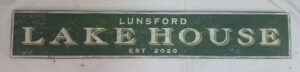 Lunsford Lake House Sign with forest green background
