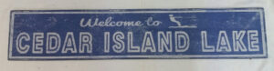 Cedar Island Lake Wood Sign with English blue background