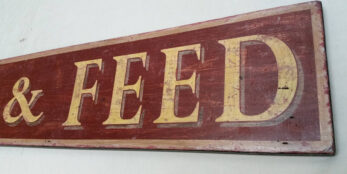 close up of antique style livery sign