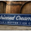 Old Fashioned Creamery Sign in English blue paint with white letters.