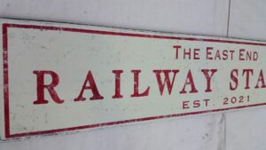 East End Train Sign customer photo, in off white and Tuscan red