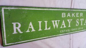 Close up of Baker Railway Train Sign photo in Kelly green