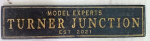 Example of the Express Junction Train Sign in black and gold paint