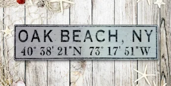 Personalized wood sign featuring city name and latitude coordinates