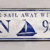 Antique style coordinate sign with a white distressed background and bold navy blue letters, customizable with personal coordinates.